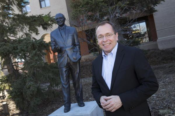 Phil Karsting, Nebraska native and Foreign Agricultural Service Administrator at the U.S. Department of Agriculture with statue of Clayton Yeutter, former U.S. Trade Ambassador and U.S. Secretary of Agriculture, and fellow UNL agricultural economics alumnus.
