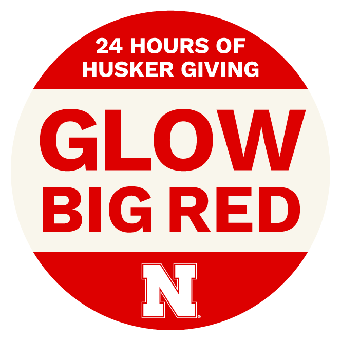 A red-and-white logo that reads "Glow Big Red — 24 Hours of Husker Giving."