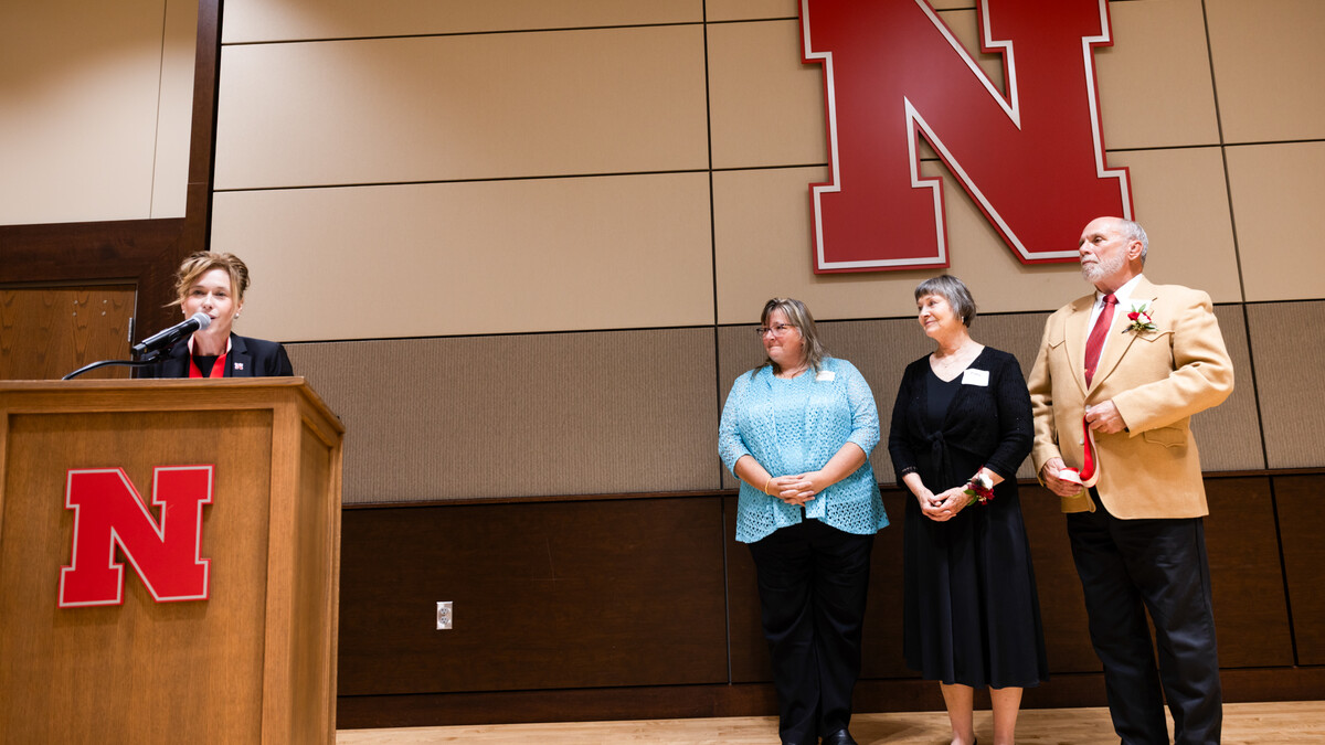 Tiffany Heng-Moss (left), interim vice chancellor for the Institute of Agriculture and Natural Resources, names Tamra Jackson-Ziems (second from left) as the John and Patty Wilson Professor of Plant Pathology. Patty and John Wilson (second from right, and right, respectively) stand next to her.