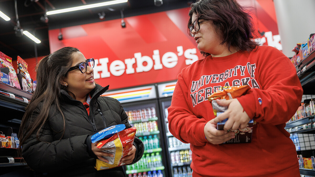 Maha Athar (left) talks with Luna Rivas as they walk down the aisles of the new Herbie’s Market in the Nebraska Union. The market opens Feb. 12 and features Amazon’s Just Walk Out technology, eliminating the need for a traditional checkout counter.