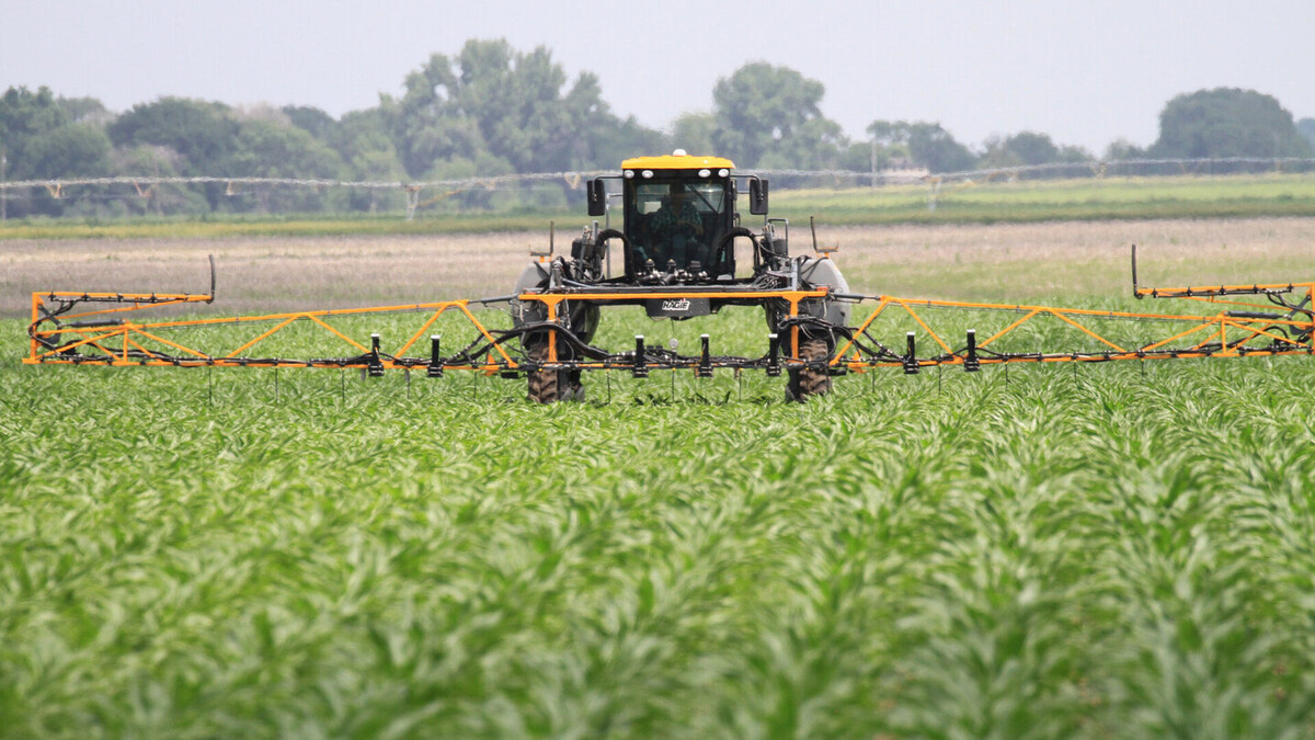 pasture with farm equipment 