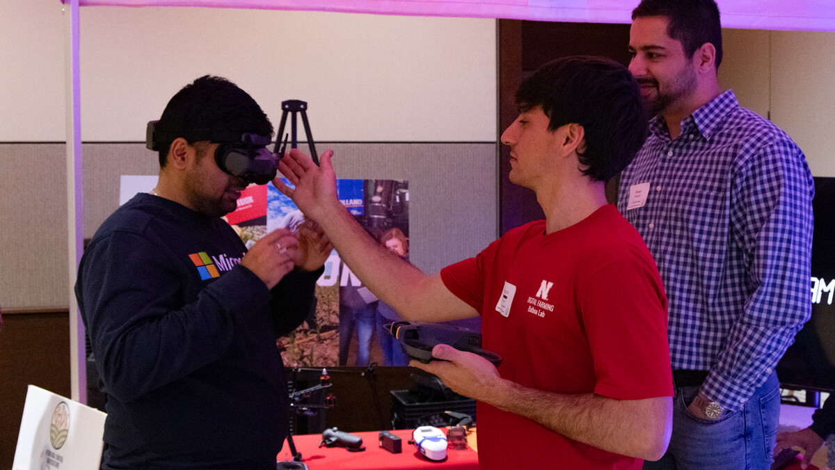 Students from the Digital Farming Lab and the Machine Automation & Agricultural Robotics (MAARS) Lab demonstrate nutrient management and robotics research during the Digital Ag Booth showcase. 