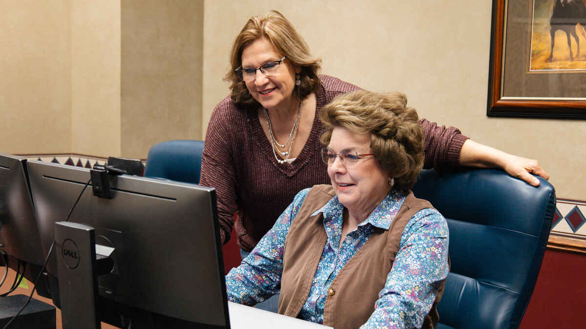 Marilyn Schlake (left) and Cheryl Burkhart-Kriesel collaborate on a content and lesson plans for the Public Participation and Engagement course.” Photo by Karlie Gerlach