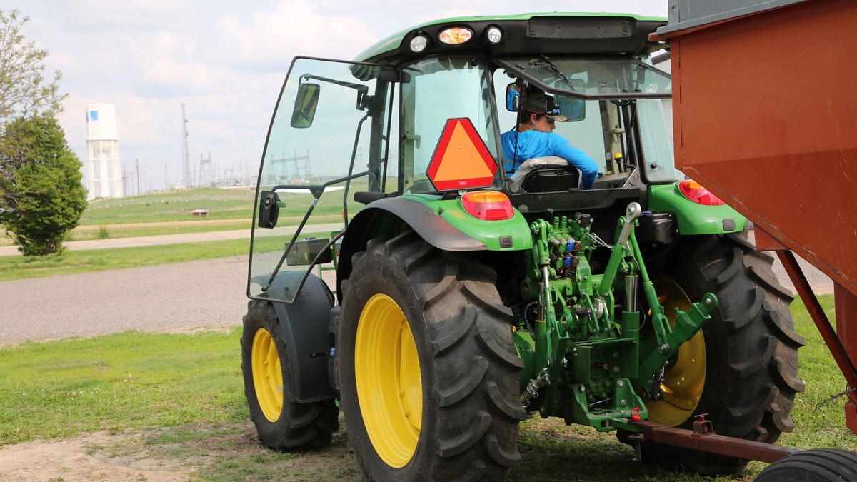 youth driving tractor