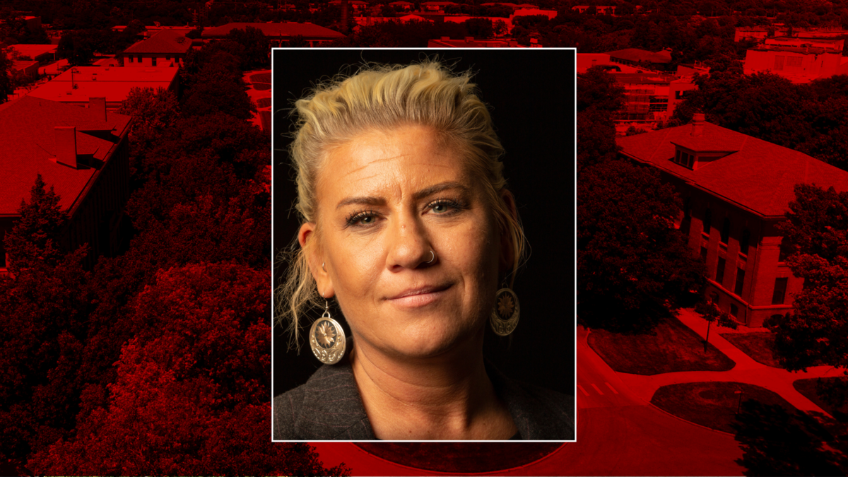 Ruth Woiwode Headshot on red background 