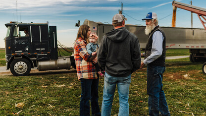 people conversing in field