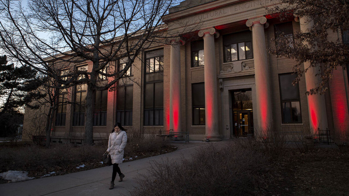 A student walking out of the Agricultural Engineering building. Links to larger image.