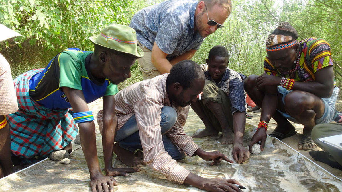 Matthew Douglass working with Daasanach men