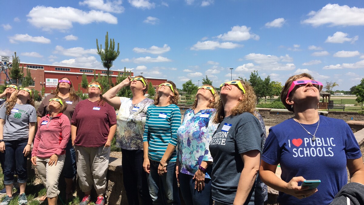 Nebraska Educators testing their solar eclipse glasses. Links to larger image.