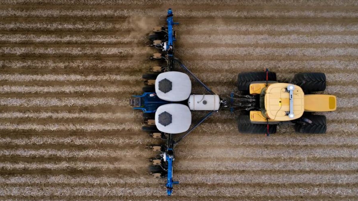 Aerial view of tractor plowing a field