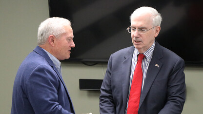 Lee Glenn, left, talks with Dr. Jeffery Gold about issues the Nebraska University faces