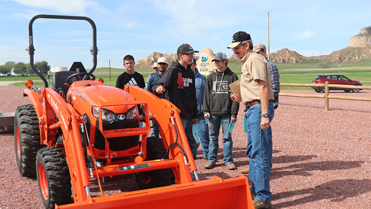 students with orange tractor 