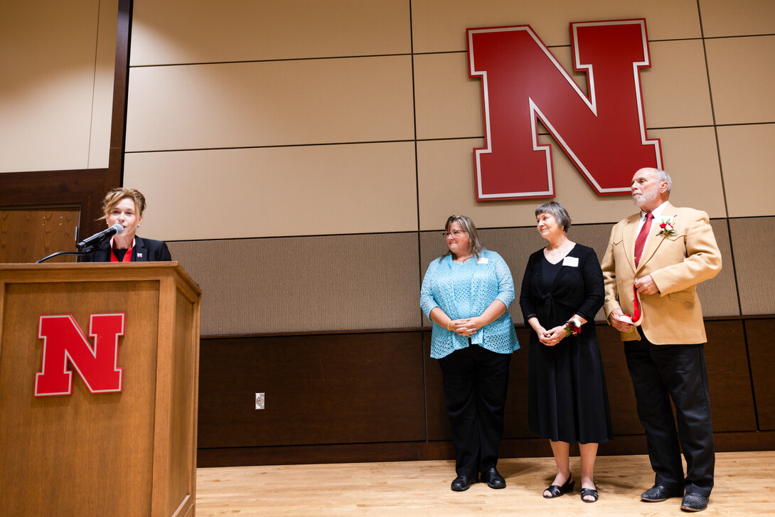 Tiffany Heng-Moss (left), interim vice chancellor for the Institute of Agriculture and Natural Resources, names Tamra Jackson-Ziems (second from left) as the John and Patty Wilson Professor of Plant Pathology. Patty and John Wilson (second from right, and right, respectively) stand next to her.