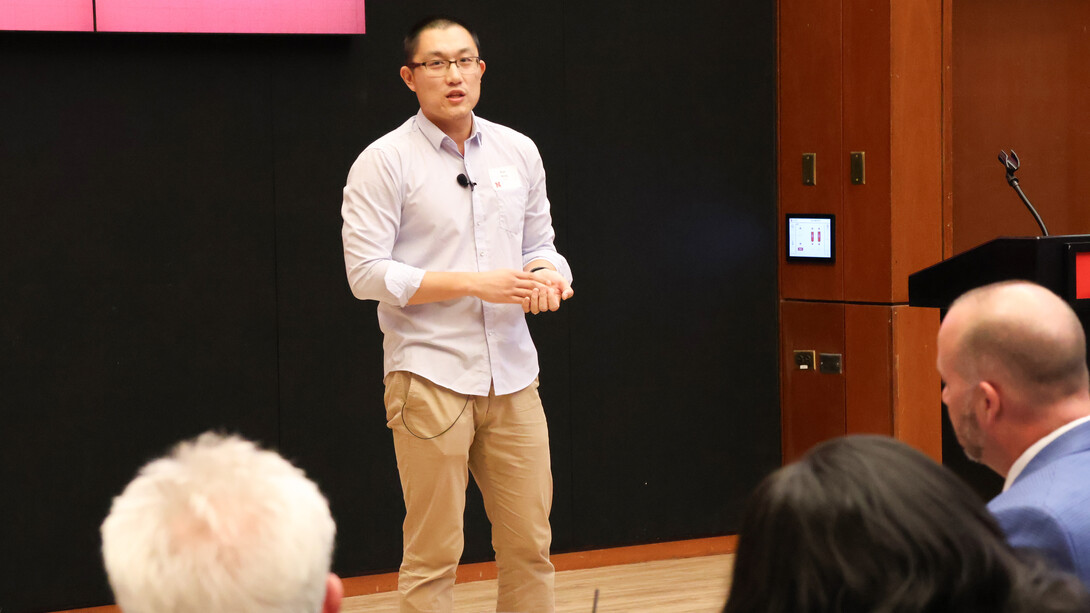 Ran Wang, assistant professor in the School of Natural Resources, speaks to a crowd.