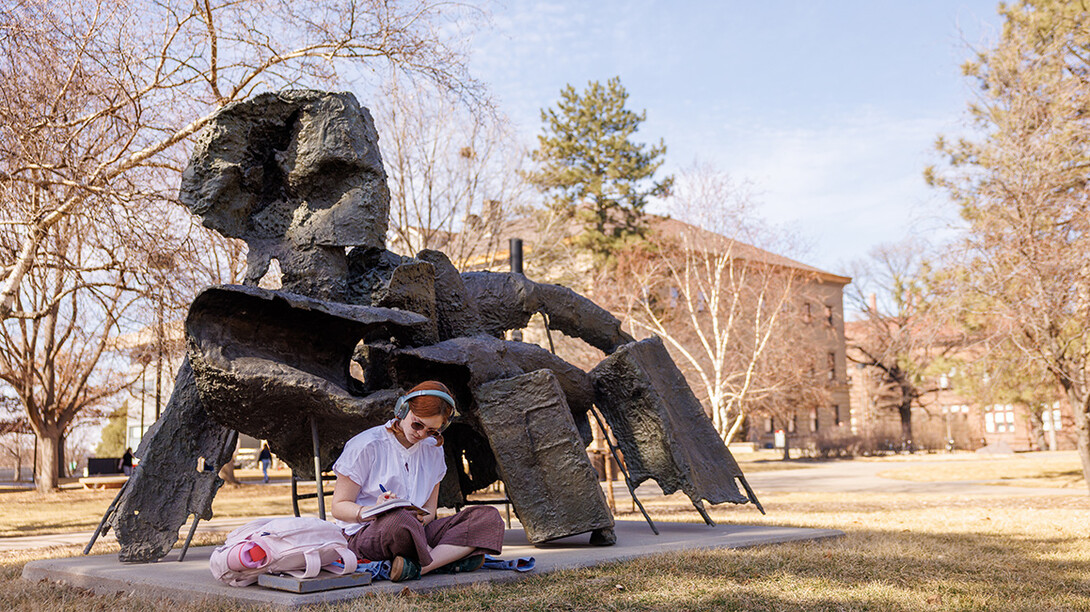 Lillian Bittle, a freshman journalism major, sits next to the Birth of Venus sculpture.