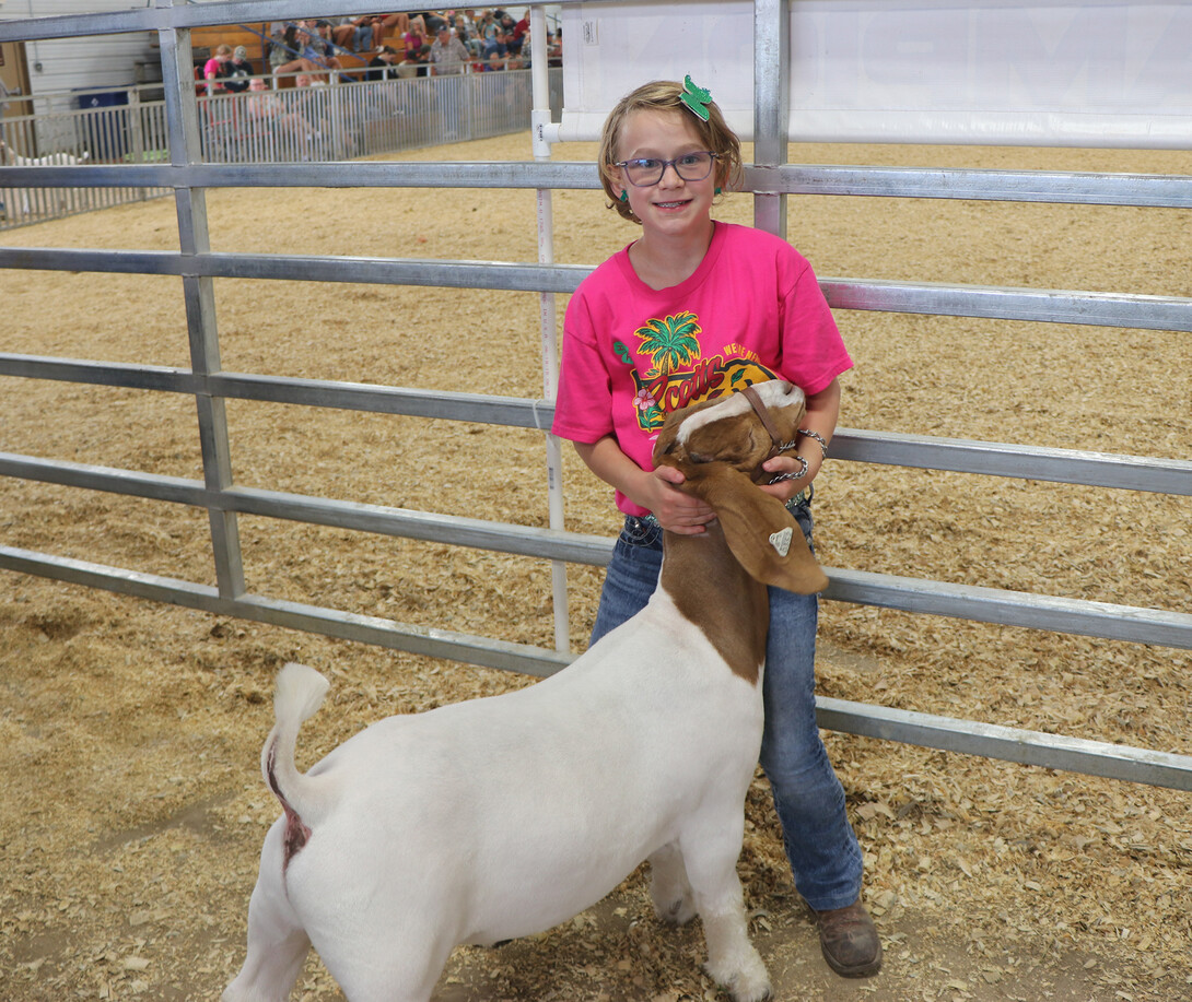 young girl with goat