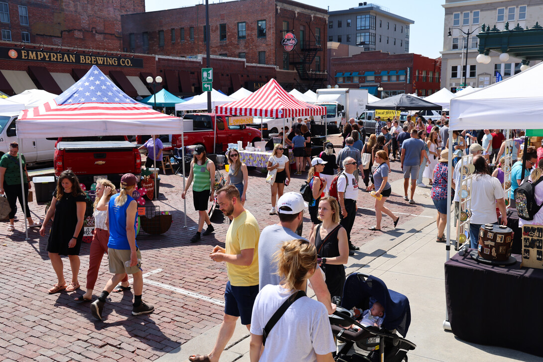 Marker goers walk the streets of the Saturday morning Haymarket Farmers Market in Lincoln