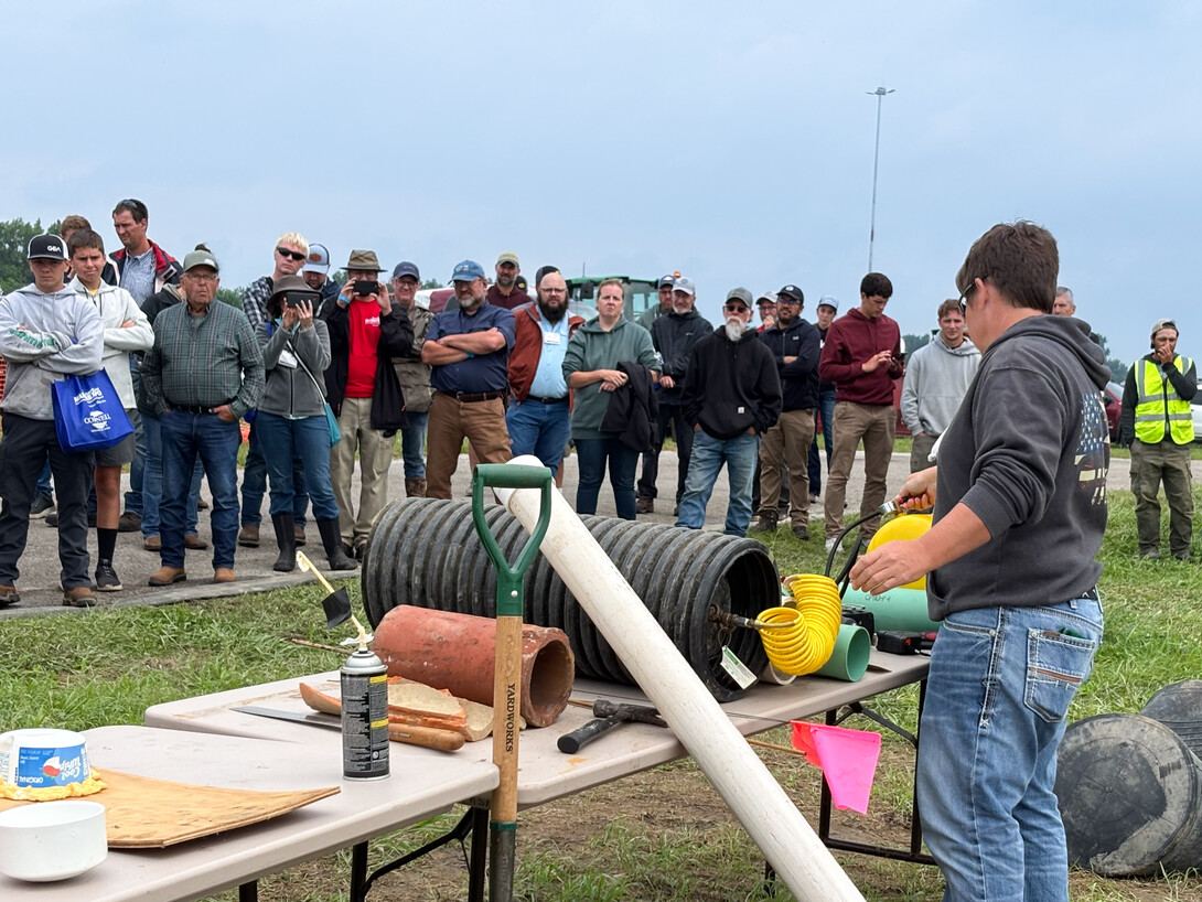 A presenter at the 2025 Expo shares about solutions for blocking tile inlets and other conduits to water in the event of a manure spill.” Photo by Bree Rody 