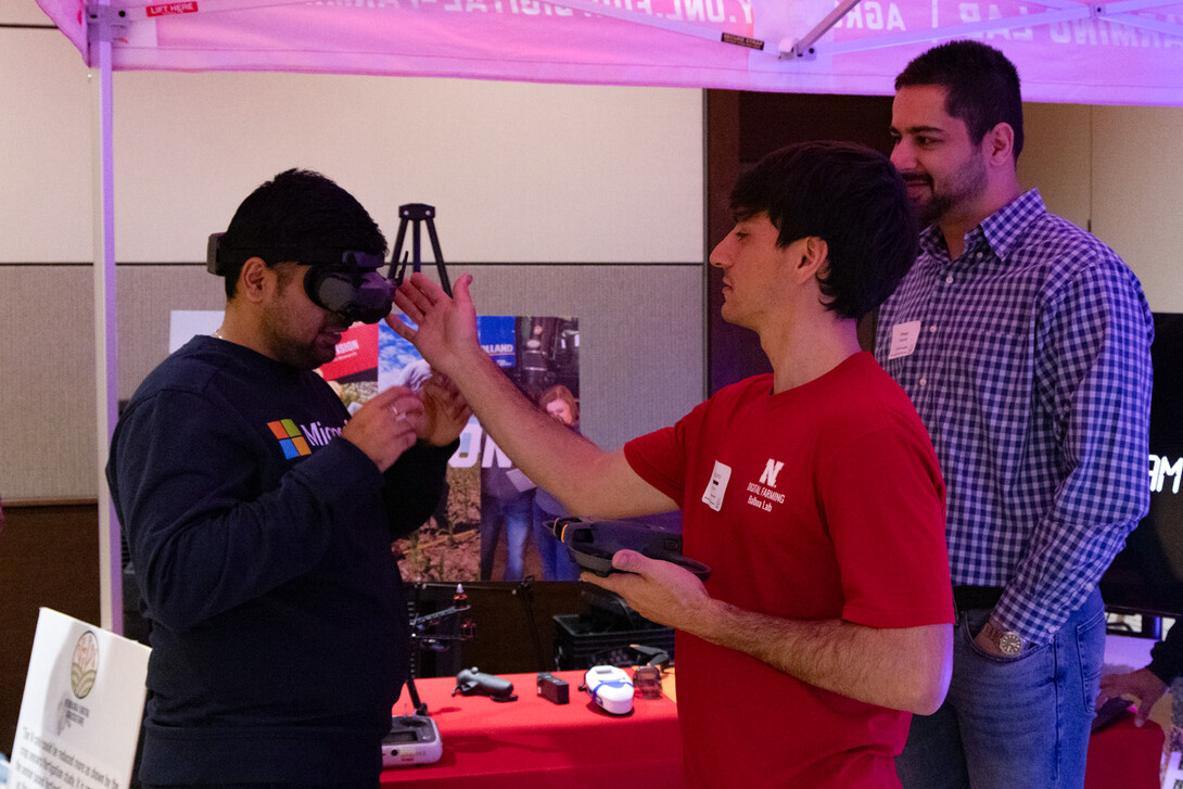 Students from the Digital Farming Lab and the Machine Automation & Agricultural Robotics (MAARS) Lab demonstrate nutrient management and robotics research during the Digital Ag Booth showcase. 