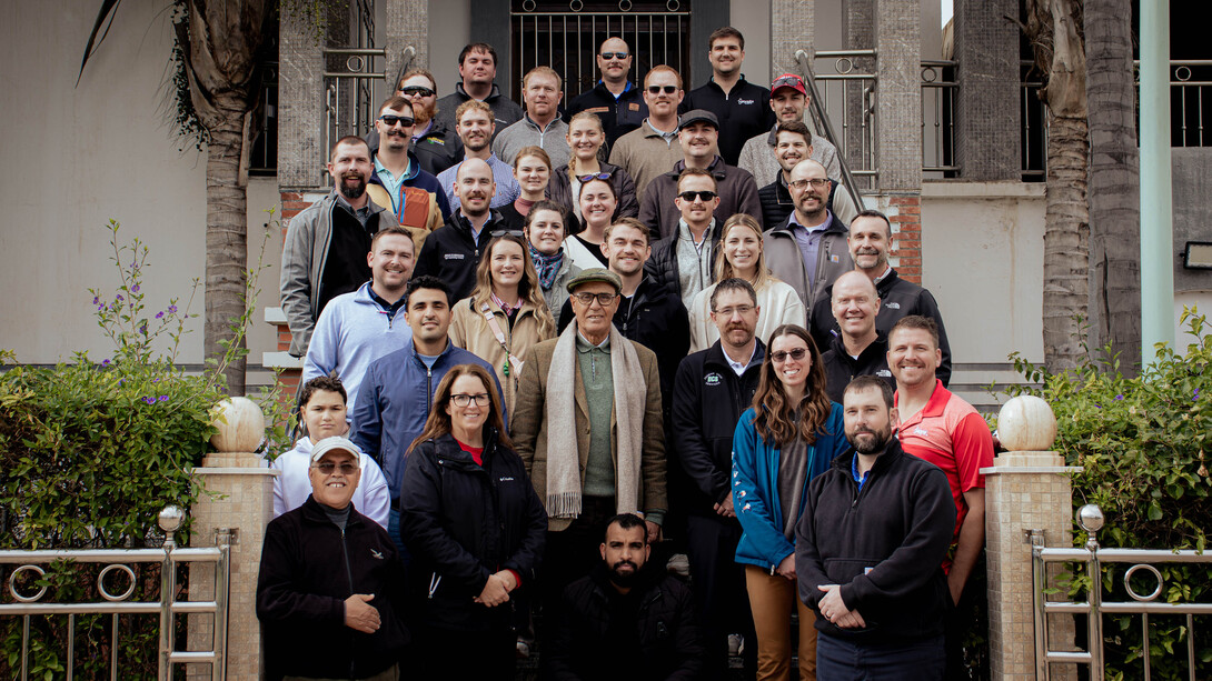 Nebraska LEAD Program class 43 students meet smile for a photo with agricultural leaders. 