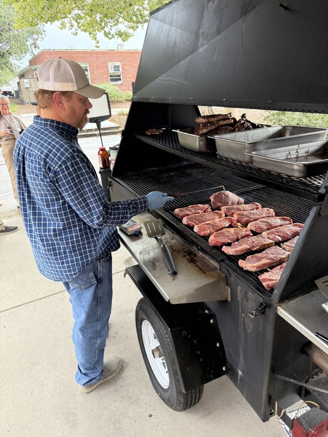 Benny Mote grilling steaks