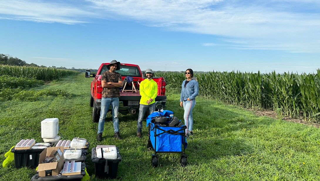 Schnable Lab technologists: Chidanand Ullagaddi, Jonathan Turkus, and Lina Lopez-Corona prepare to use the new leaf sampling system Turkus designed as part of a follow up experiment lead by the University of Nebraska to use RNA to understand differences in how same corn hybrids performed in different field experiments at six different universities across the United States. 