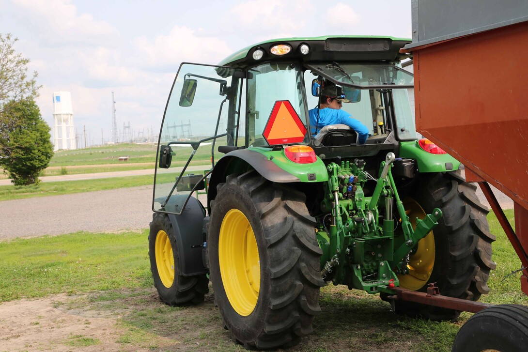 youth driving tractor