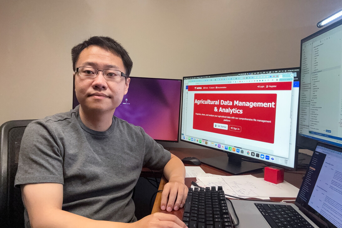 Yu Pan in his office with a computer