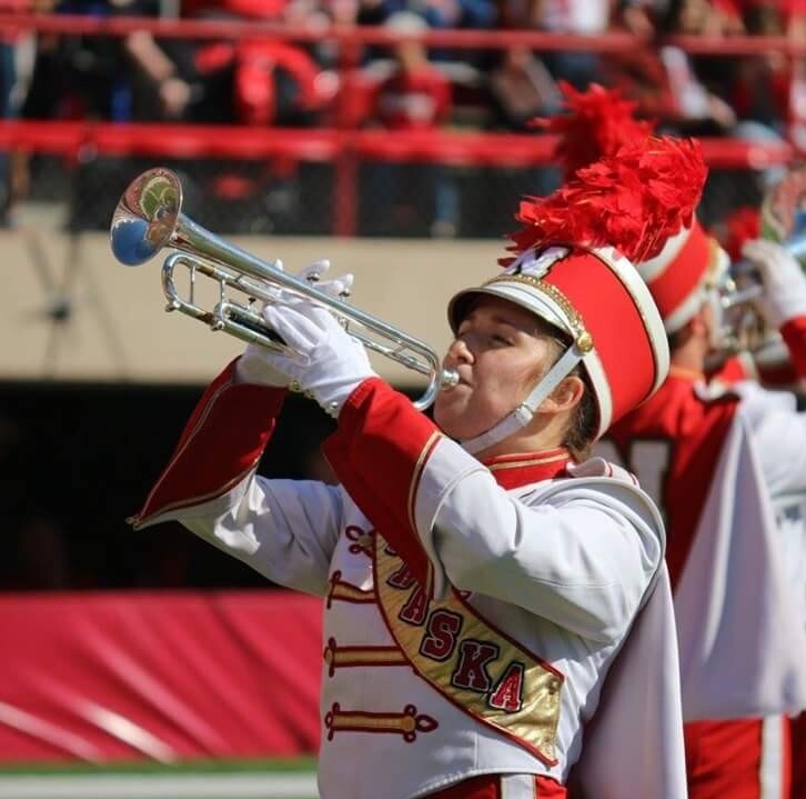 Shannon Rezac playing trumpet with the University of Nebraska marching band. Links to larger image.