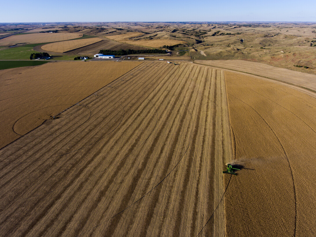 Aerial view of tractor plowing a field