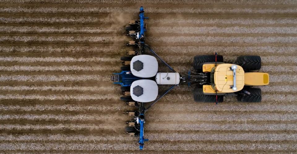 Aerial view of tractor plowing a field