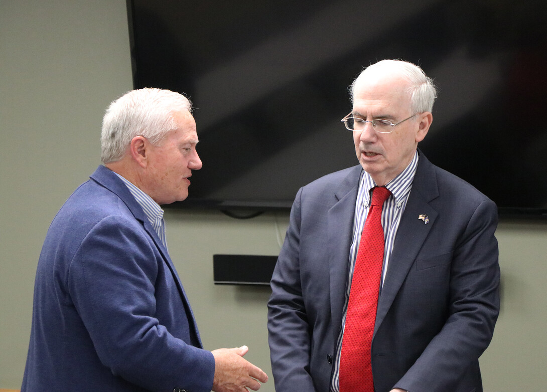 Lee Glenn, left, talks with Dr. Jeffery Gold about issues the Nebraska University faces