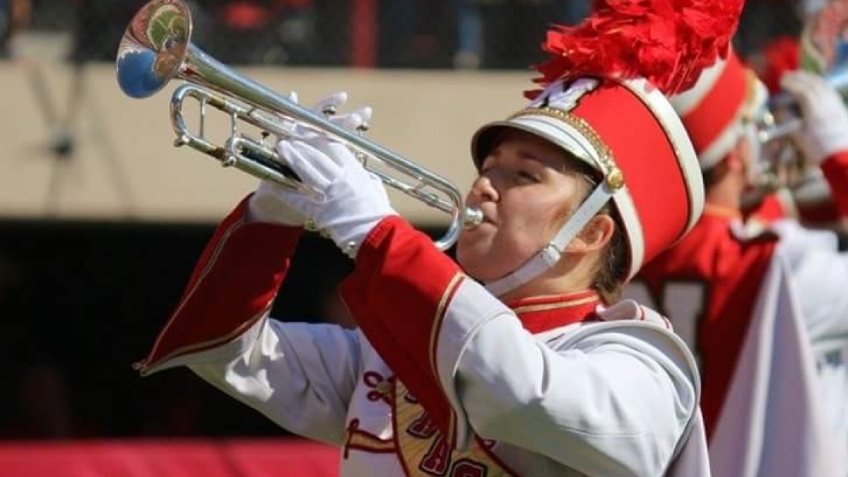 Shannon Rezac playing trumpet with the University of Nebraska marching band. Links to larger image.