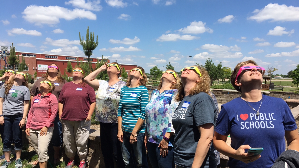Nebraska Educators testing their solar eclipse glasses. Links to larger image.