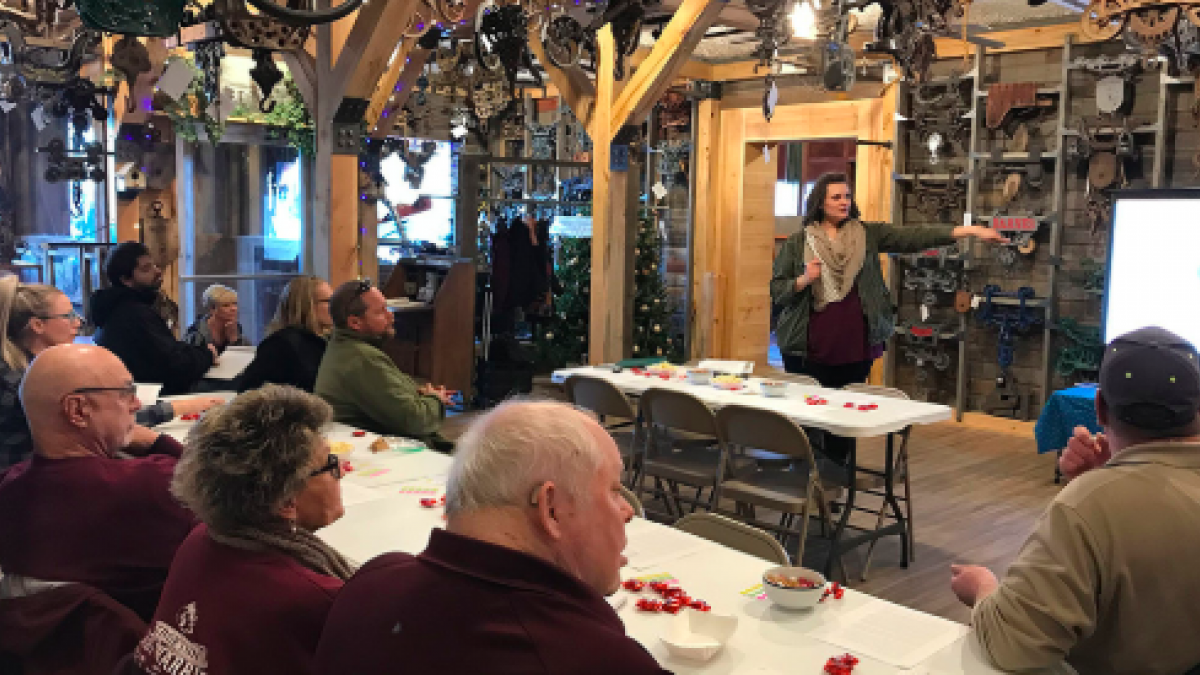 Megan Hanefeldt, with the Knox County Development Agency, talks with community members in Crofton.