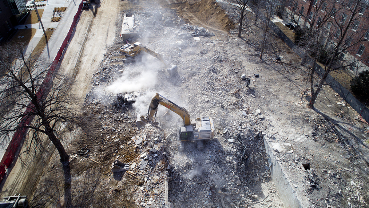 Crews clean up concrete and debris at the Cather Pound demolition site in February 2018