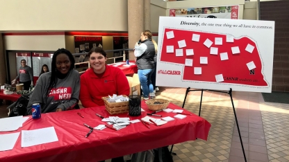 students at welcoming booth