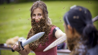woman with a sword and beard of bees