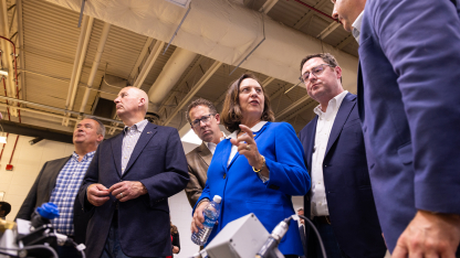 Members of the Nebraska delegation look on as Sen. Deb Fischer (center) talks with a university researcher during an East Campus visit on June 19.