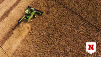 A bird's-eye view of a combine harvesting soybean