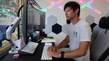 Cody Lawson works on his computer at 1to1 Technologies in Central City, Nebraska. He credits mentorship from Doris Lux, an eCoach with Rural Prosperity Nebraska’s eCommunities entrepreneurship program, as a key contributor to his startup’s growth.