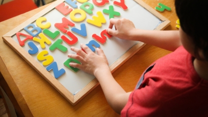 child learning alphabet