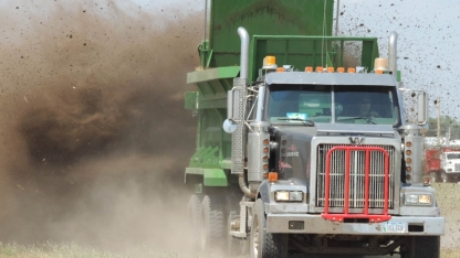 a truck spreading manure