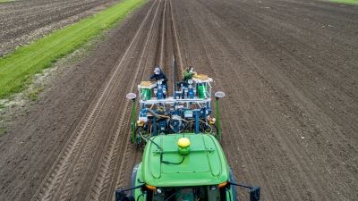 Aerial view of tractor plowing a field