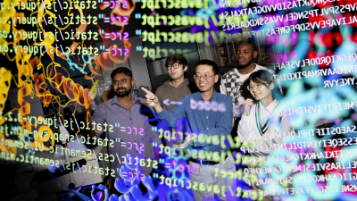 Four men and a woman stand amid colorful lines of code.